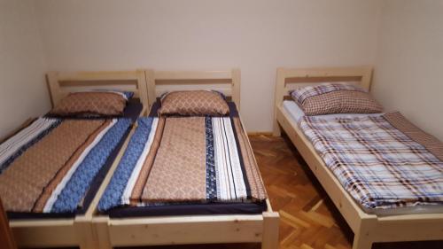 two bunk beds sitting in a room with at M&M Apartman in Tiszafüred