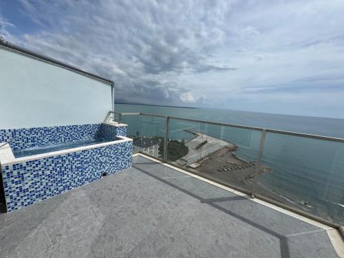 a balcony with a view of the ocean at Suite Rana Hedhun in Shëngjin