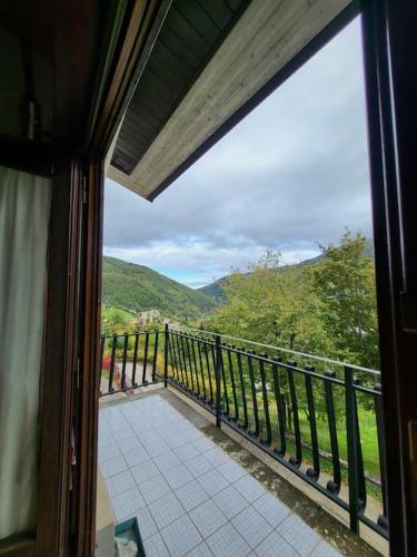 a view of a balcony from a train window at Appartamento a Pieve in Pievepelago