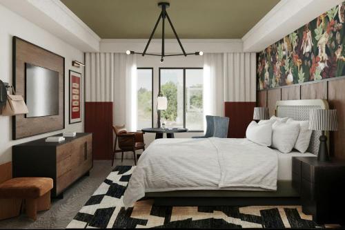 a bedroom with a bed and a desk and a chair at The SOMM Hotel & Spa, Autograph Collection in Woodinville