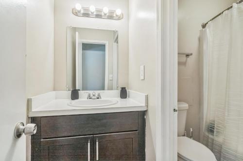 a bathroom with a sink and a mirror at Rex Townhomes 2401a I Comfy 2 Bed 2 Bath in Ellenwood
