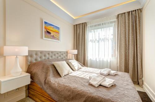 Postel nebo postele na pokoji v ubytování Bentley Home Sopot
