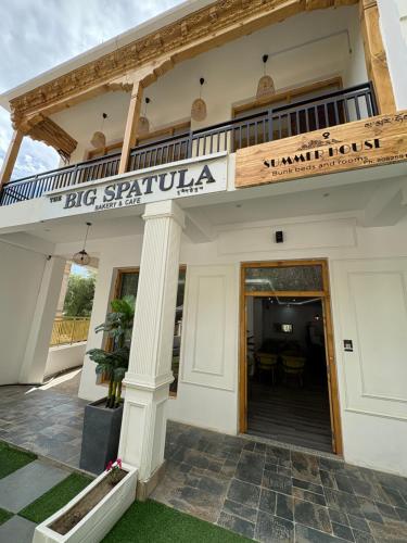 a building with a sign that reads big spainula at Summer house leh in ladakh