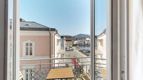 a view of a city from a balcony at Apartment am Traunsee in Gmunden