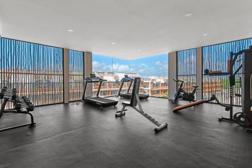 a gym with several exercise bikes in a large room at Tropical getaway in Tulum with private pool in Tulum