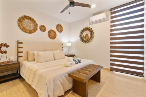 a bedroom with a bed and a ceiling fan at Tropical getaway in Tulum with private pool in Tulum