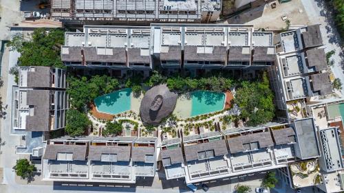 an overhead view of a building with two swimming pools at Tropical getaway in Tulum with private pool in Tulum