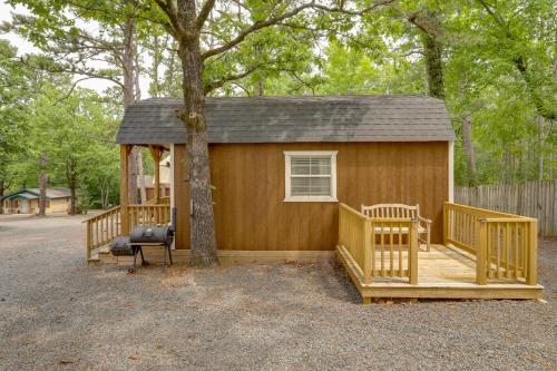 a small house with a tree in front of it at Romantic Escape in Greers Ferry Less Than 1 Mi to Lake in Higden