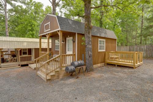 a small house with a tree in front of it at Romantic Escape in Greers Ferry Less Than 1 Mi to Lake in Higden