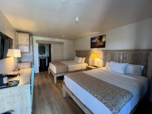 Ένα ή περισσότερα κρεβάτια σε δωμάτιο στο Hotel DeVille