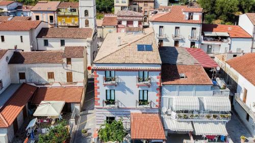 an aerial view of a city with houses at Harmonia Home Capitello in Capitello