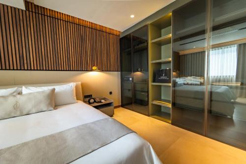 Nohian Collection Hotelsにあるベッド