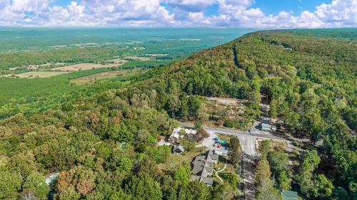 an aerial view of a forested area with a road in the middle at Downtown Mentone - Baileys Bungalow in Mentone
