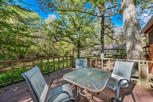 a patio with chairs and a table on a deck at Downtown Mentone - Baileys Bungalow in Mentone