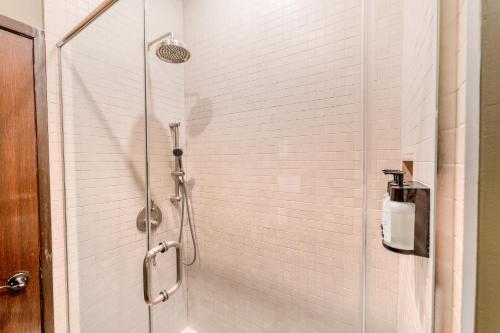 a shower with a glass door in a bathroom at Self Check-In Boutique Hotel - Quartier latin - Room 101 in Montréal