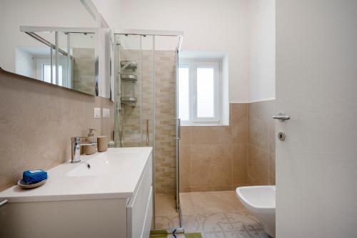 a bathroom with a sink and a shower at GuestHost - Oasi Monticelli in Polignano a Mare