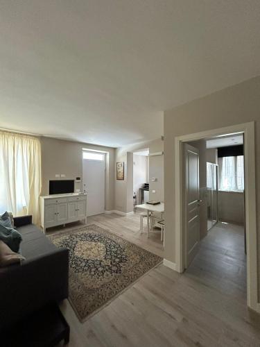 a living room with a couch and a table at Casa CaBì in Senigallia