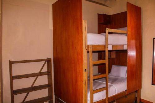 a couple of bunk beds in a room at Loki Cusco in Cusco