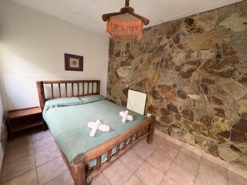 a bedroom with a bed with two bows on it at Jujuy Hostel in San Salvador de Jujuy