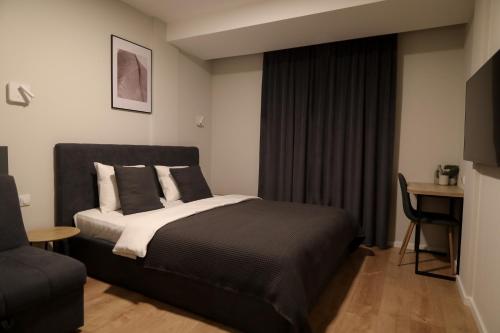 Postel nebo postele na pokoji v ubytování Stari Hrast Apartmani