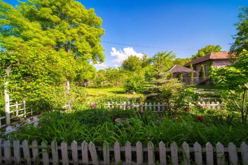 a white picket fence in front of a garden at Holiday Home Ruben in Odzun