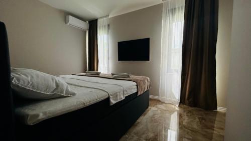 Ένα ή περισσότερα κρεβάτια σε δωμάτιο στο Villa LUSSO