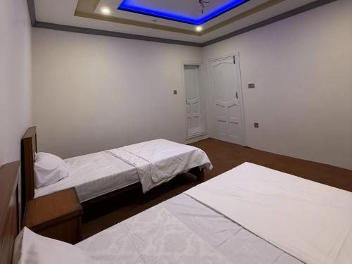 Postel nebo postele na pokoji v ubytování Aba-SHAH GUEST HOUSE SKARDU