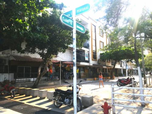 a street sign with two street signs on a pole at APARTAMENTO RODADERO MIRAMAR In in Gaira