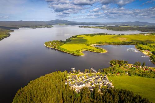 an aerial view of a resort on a lake at Lipno Lakeside 45 in Frymburk