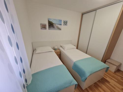 Katil atau katil-katil dalam bilik di Apartman "Flower Garden"