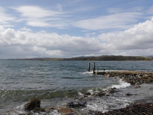 a view of a body of water with a pier at Tirlaggan Úr in Oban