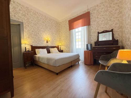 Hotel Do Parque, Boutique Hotel - Curiaにあるベッド