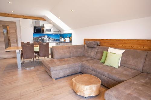 a living room with a couch and a table at Altroiterhof in St. Wolfgang