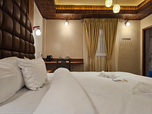 Ένα ή περισσότερα κρεβάτια σε δωμάτιο στο Hotel Golden Orchid
