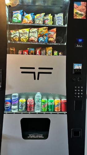 a refrigerator filled with lots of different types of food at Mount Blue Motel in Farmington