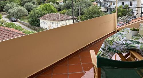 a table on the balcony of a building at Sami Loft in Sami