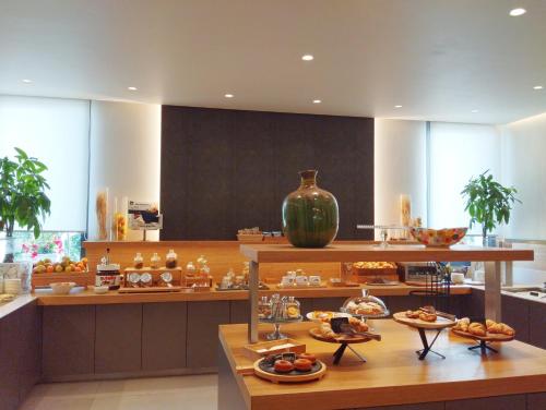 a kitchen with a bunch of food on display at Hotel Calinferno in Codognè