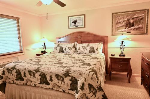 a bedroom with a large bed and two night stands at Yellowstone Gateway Inn in Gardiner