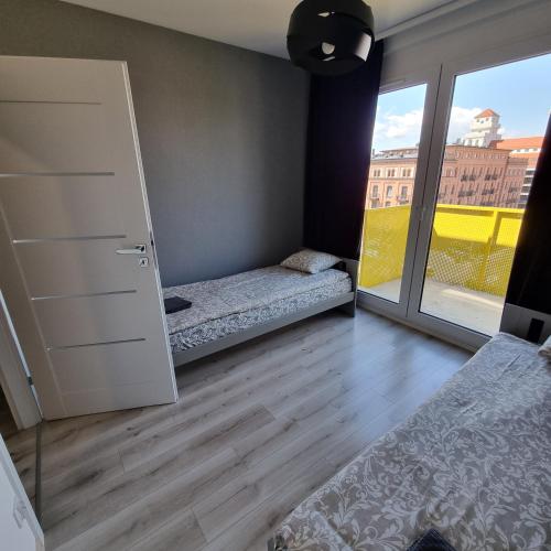 Katil atau katil-katil dalam bilik di Apartament Skarbowa Sky