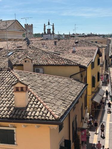 an overhead view of roofs of buildings in a city at Appartamenti BETTELONI in Bardolino