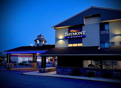 a restaurant with a sign on the side of a building at Baymont by Wyndham Missoula in Missoula