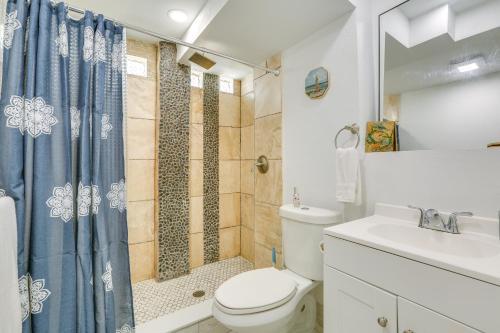 a bathroom with a toilet and a shower and a sink at Walk to Beach Fort Meyers Home with Patio! in Fort Myers Beach