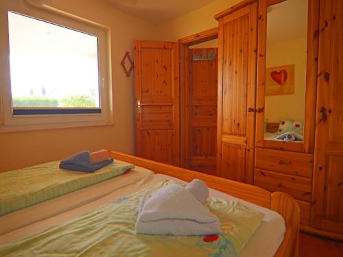 Cama o camas de una habitación en Exklusiver Bungalow mit Terrasse in Rerik