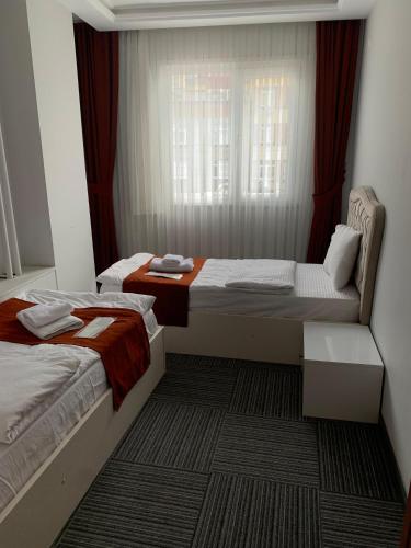 Ένα ή περισσότερα κρεβάτια σε δωμάτιο στο Vira Suite Otel