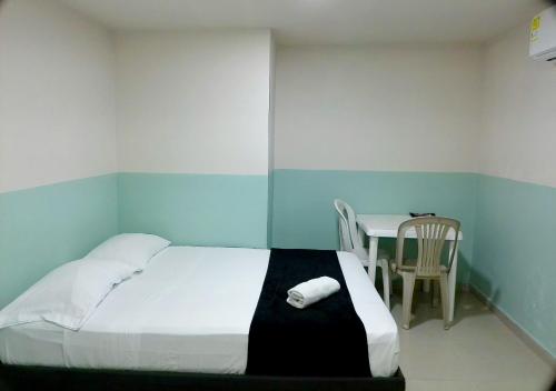Ένα ή περισσότερα κρεβάτια σε δωμάτιο στο Hotel HIH