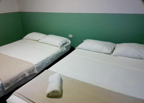 Ένα ή περισσότερα κρεβάτια σε δωμάτιο στο Hotel HIH