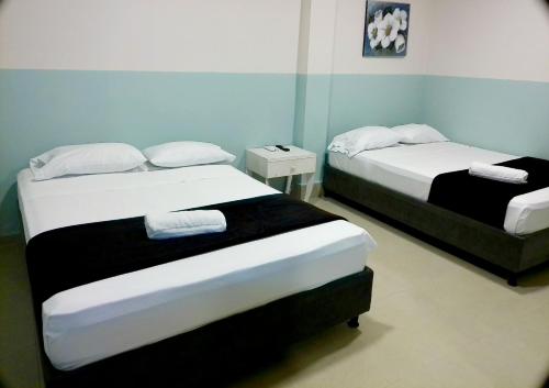 Ένα ή περισσότερα κρεβάτια σε δωμάτιο στο Hotel HIH