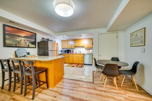 a kitchen with a table and chairs and a dining room at 8 Mi to Dtwn Seattle Pet-Friendly Apt with Hot Tub in Mercer Island