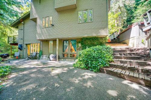 a house with a staircase leading to the front door at 8 Mi to Dtwn Seattle Pet-Friendly Apt with Hot Tub in Mercer Island
