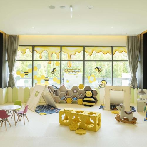 a childrens play room with a large window at DoubleTree By Hilton Seoul Pangyo in Seongnam